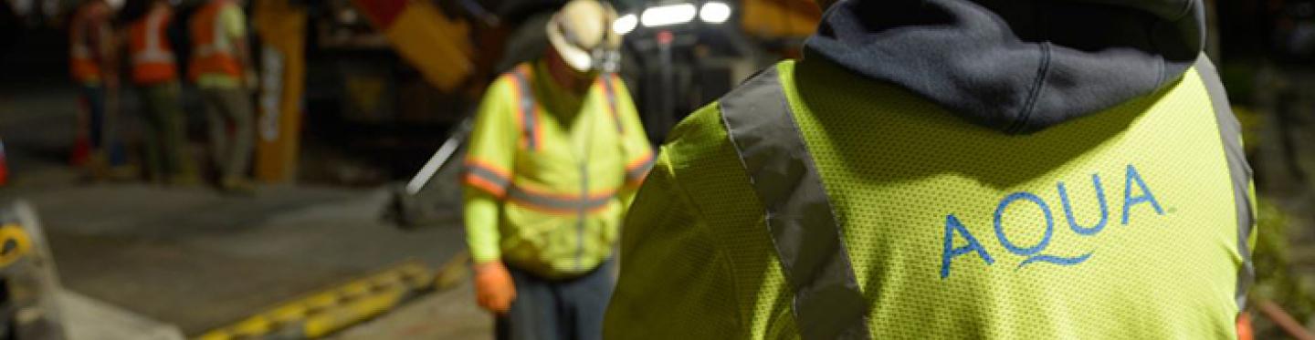 Employees digging at night