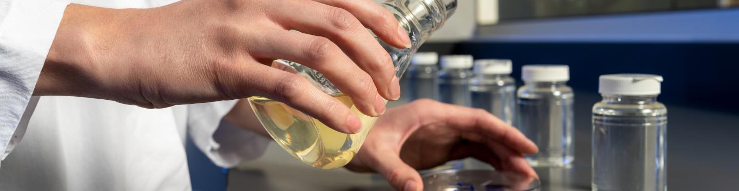 hand and equipment in the lab